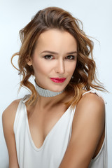Naklejka premium Curly hair fashion model with natural makeup and red lips