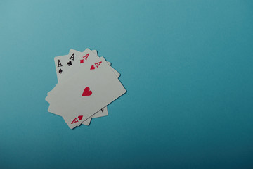 A winning poker hand of four aces playing cards