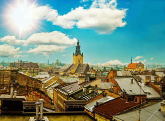 architecture and the roofs of houses and the old town church on a sunny day