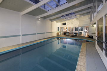 Indoor pool with tilted roof.