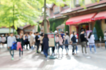 blurred people at the theme park © naiyanab