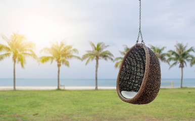 Rattan lounge hanging chair with white pillow