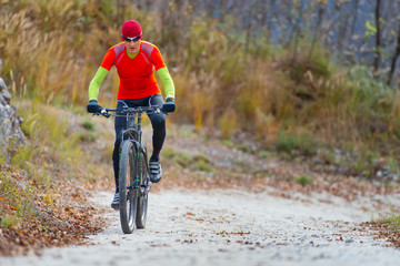 Biker in mountain dirt road