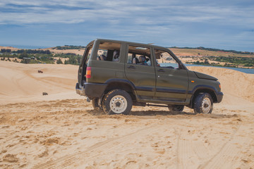 Desert Safari - Off-road vehicle driving in the Sand Sea, White Sand Dunes, Vietnam, Travel...