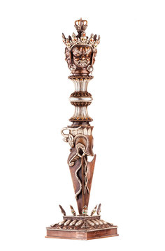 Ritual blade of Phurba which is used in Tantric Buddhism of destruction of all concepts and attachment to an ego. Isolated on a white background