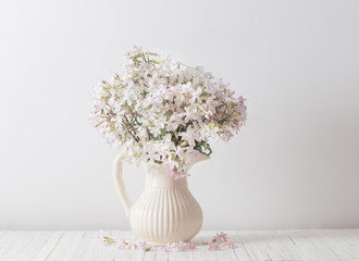  flowers in a vase on white background