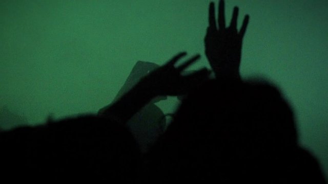 Hands Moves in Slow Motion Above the Raving Crowd in the Night Club