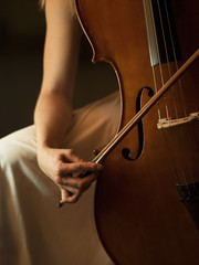 close up of woman playing cello