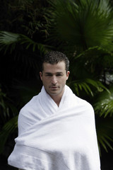 man wrapped in towel