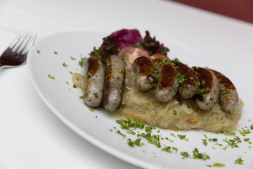 traditionally bavarian bratwurst with sauerkraut