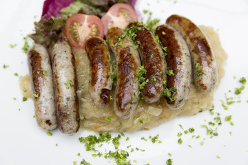 traditionally bavarian bratwurst with sauerkraut