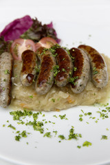 traditionally bavarian bratwurst with sauerkraut