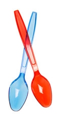Two colorful plastic spoons close-up isolated on white.