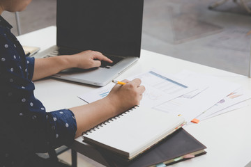 businesswoman working with document and computer in office workp