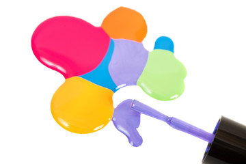 Multi-colored nail polish and brush.