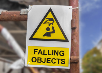 Danger construction with falling objects yellow sign