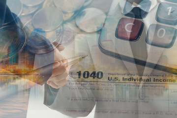 Double exposure of business handshake and  tax form for taxation concept 
