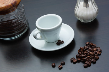 pile of coffee beans and a cup