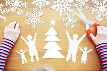 Little girl dreams about winter holidays together with full family. Concept with paper scrapbooking