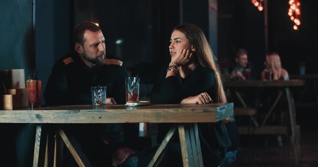 Couple date at bar 4k video. Young woman and man with beverage talking, laughing, smiling and flirt - Powered by Adobe