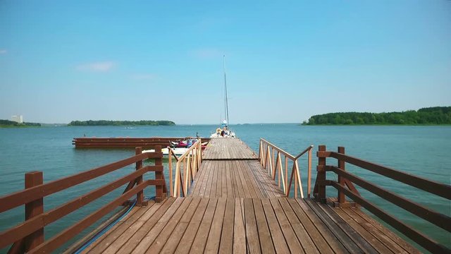 Wooden pier on a lake stretching into the distance