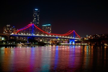 Fototapeta na wymiar red and blue bridgelights at night