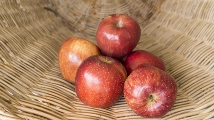 red apples in the basket, selected focus on some apple and the b