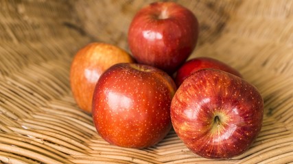red apples in the basket, selected focus on some apple and the b