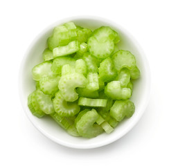 Bowl of celery isolated on white, from above