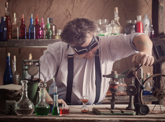 crazy medieval scientist working in his laboratory