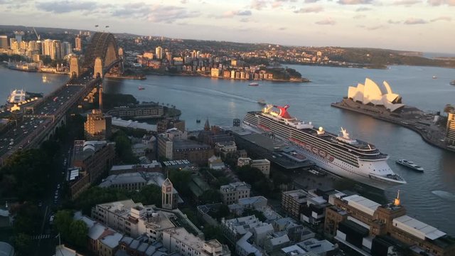 SYDNEY - OCT 19 2016:Timelapse Aerial view of Ocean Liner leaves Sydney Harbour from Sydney Cove at dusk in New South Wales, Australia.
