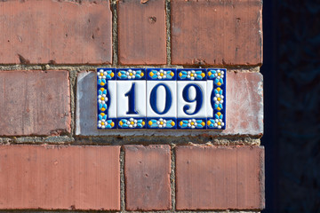 House number 109 sign