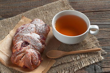 Tea and bun with jam