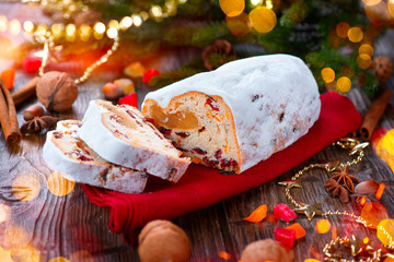 Christmas stollen. Traditional sweet fruit loaf with icing sugar