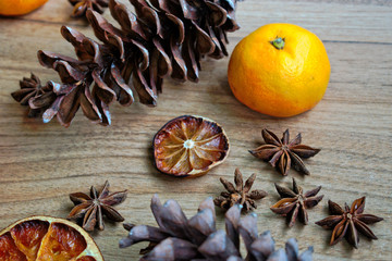 Fruit and pine cones on a wooden table