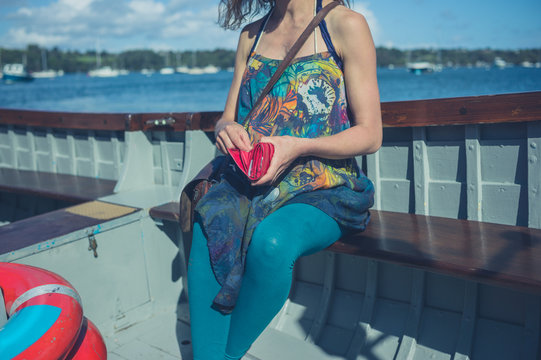 Woman in boat with a purse