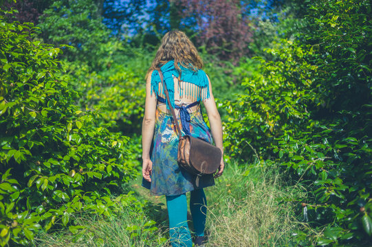 Woman wearing unusual outfit in forest