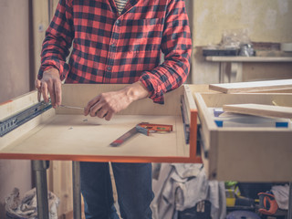 Carpenter building a drawer