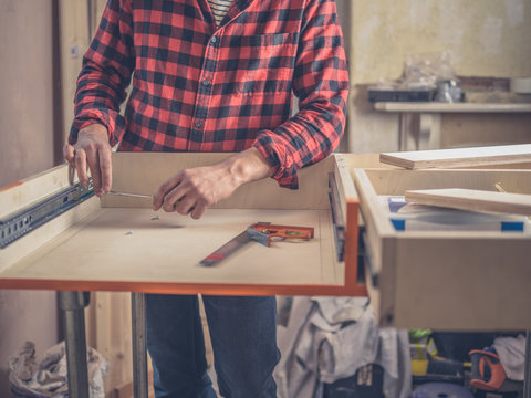 Carpenter building a drawer
