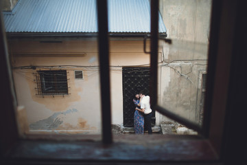 Romantic moment of a couple in a lovely alley