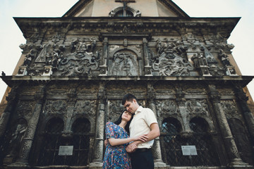 Fototapeta na wymiar Ancient beautiful church and a lovely couple