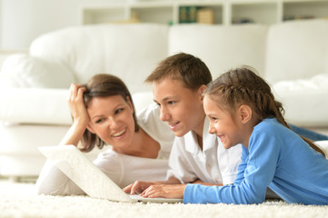 portrait of happy Family with laptop