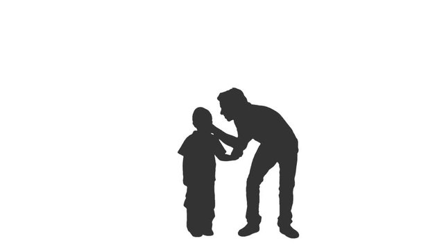 Silhouette of a little boy in a baseball cap standing with his father. Front view. Full HD footage with alpha channel