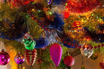 Beautiful background decorated Christmas tree with toys. The idea for postcards. Soft focus. Shallow DOF