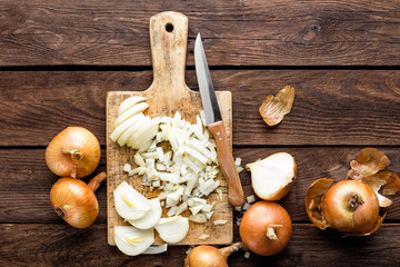 raw onion chopped on wooden board