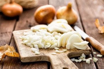 Fototapeta na wymiar raw onion chopped on wooden board