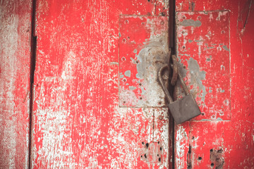 lock and Red rustic reclaimed wooden wall background, selective