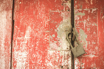 lock and Red rustic reclaimed wooden wall background, selective