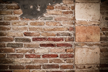 red brick wall texture grunge background with vignetted corners,