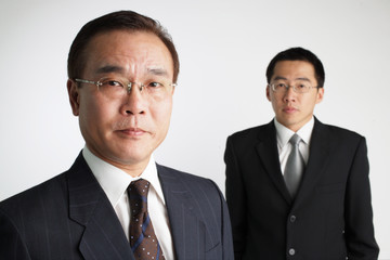 Two Businessmen looking at camera